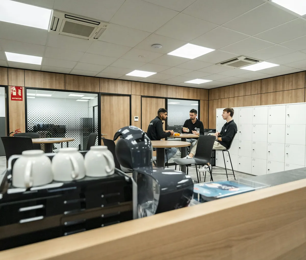 Modern workplace break area with seating and refreshments