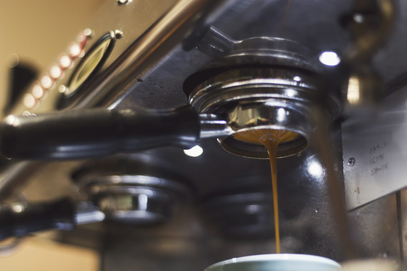 Espresso pouring from an office coffee machine